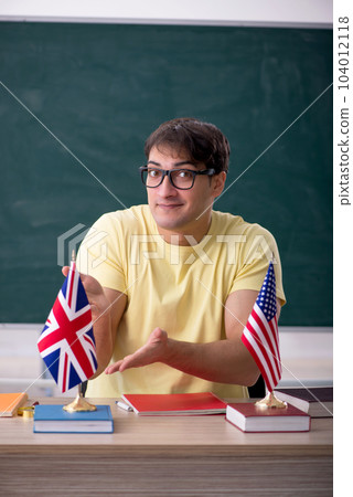 Young male English language teacher in the classroom 104012118