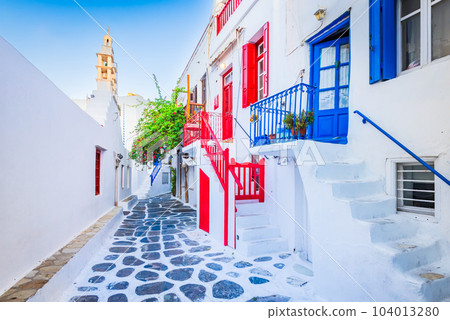 Mykonos, Greece - Cobblestone alley whitewashed village Cyclades Islands 104013280