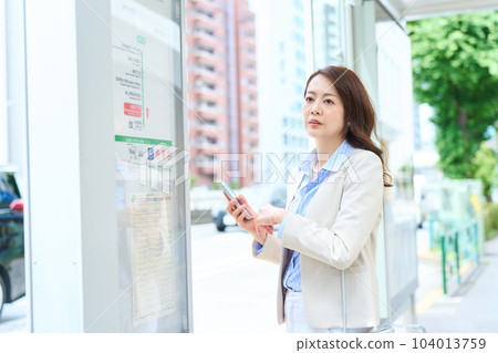A woman riding a bus A woman riding a bus 104013759