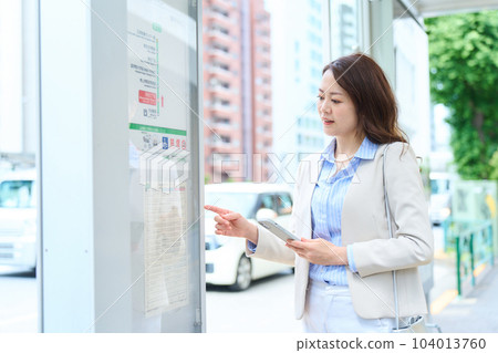 A woman riding a bus A woman riding a bus 104013760