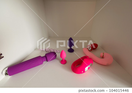 Lots of different vibrators in the closet.... - Stock Photo [104015446]