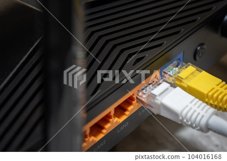 Close-up of network cables connected to router. Selective focus. 104016168