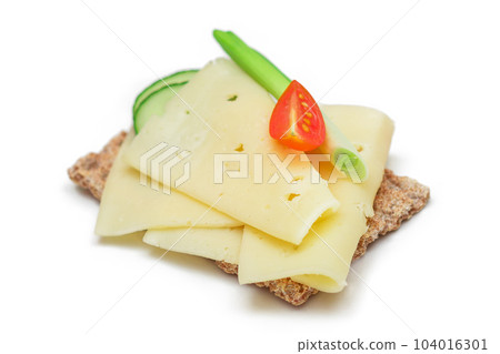 Whole Grain Crispbread with Cheese, Fresh Cucumber, Radish, Tomato and Green Onions - Isolated Whole Grain Crispbread with Cheese, Fresh Cucumber, Radish, Tomato and Green Onions - Isolated 104016301