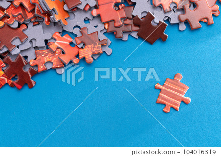 Colorful Jigsaw Puzzle on Blue Background Colorful Jigsaw Puzzle on Blue Background 104016319