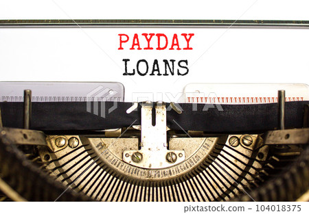 Payday loans symbol. Concept words Payday loans typed on beautiful old retro typewriter. Beautiful white background. Business and Payday loans concept. Copy space. 104018375