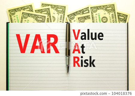 VAR Value at risk symbol. Concept words VAR Value at risk on beautiful white note. Dollar bills. Beautiful white table white background. Business and VAR Value at risk concept. Copy space. VAR Value at risk symbol. Concept words VAR Value at risk on beautiful white note. Dollar bills. Beautiful white table white background. Business and VAR Value at risk concept. Copy space. 104018376