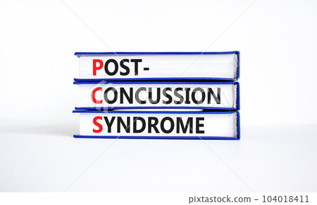 PCS post-concussion syndrome symbol. Concept words PCS post-concussion syndrome on books on a beautiful white table white background. Medical PCS post-concussion syndrome concept. Copy space. 104018411