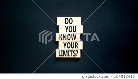 Do you know your limits symbol. Concept words Do you know your limits on wooden block. Beautiful black table black background. Business do you know your limits concept. Copy space. 104018418