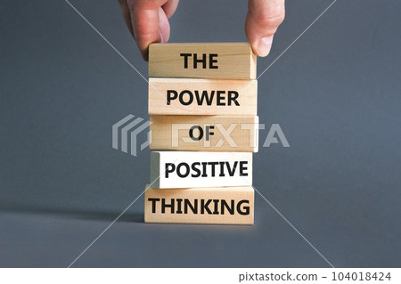 Positive thinking symbol. Concept words The power of positive thinking on wooden block. Beautiful grey background. Businessman hand. Business, motivational positive thinking concept. Copy space. 104018424