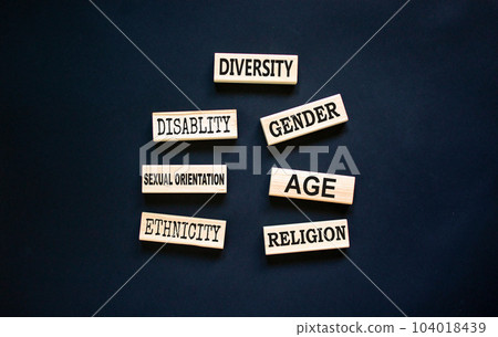 Diversity symbol. Diversity ethnicity gender age sexual orientation religion disability words written on wooden block. Beautiful black background. Equality and diversity concept. Copy space. 104018439