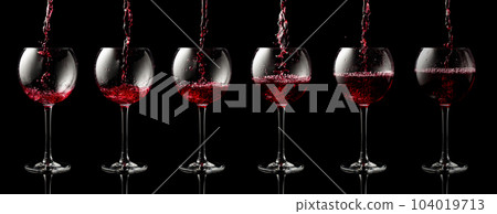 Pouring red wine into a glass. Pouring red wine into a glass. 104019713
