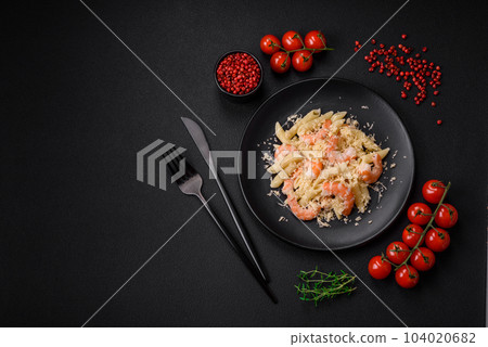 Delicious fresh penna pasta with shrimp, sauce, cheese, salt and spices Delicious fresh penna pasta with shrimp, sauce, cheese, salt and spices 104020682