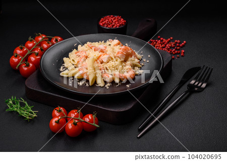 Delicious fresh penna pasta with shrimp, sauce, cheese, salt and spices 104020695