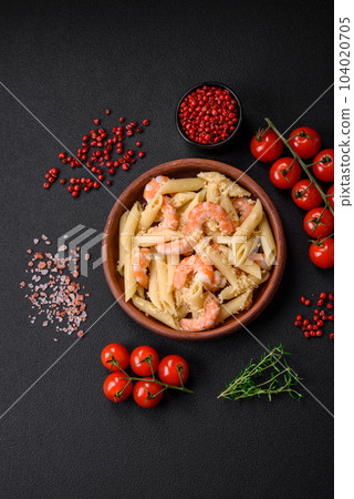 Delicious fresh penna pasta with shrimp, sauce, cheese, salt and spices 104020705