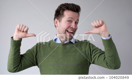 The European young man proudly points at himself, saying I am good with myself 104020849