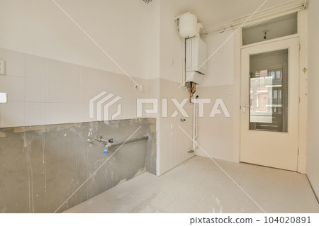 a bathroom that is in the process of being remodeled and remeded to make way for new toiletries 104020891