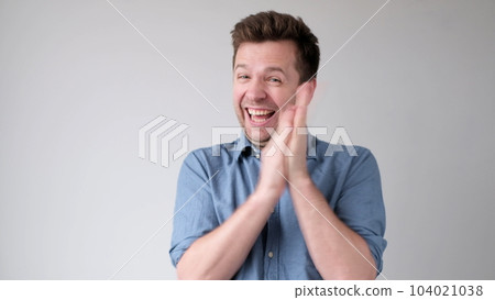 European young man applauds, praising someone for their work European young man applauds, praising someone for their work 104021038