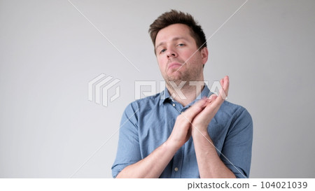 European young man applauds, praising someone for their work 104021039
