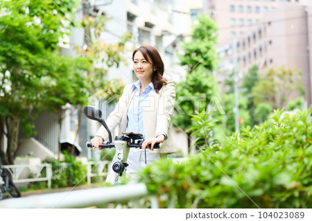 Female driving an electric kickboard Female driving an electric kickboard 104023089