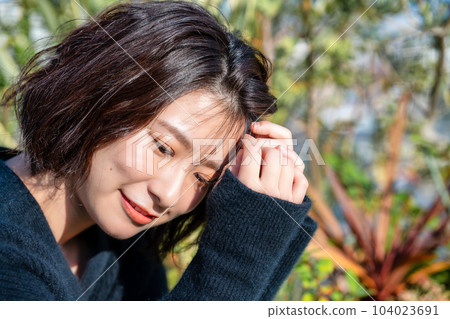 Profile of a woman wearing black knit Profile of a woman wearing black knit 104023691