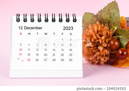 The December 2023 Desk calender on pink background. The December 2023 Desk calender on pink background. 104024583