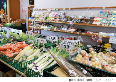 A farmer's market selling a variety of vegetables and agricultural products at a roadside station A farmer's market selling a variety of vegetables and agricultural products at a roadside station 104024782