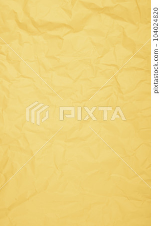The Vertical yellow color creased paper background texture. The Vertical yellow color creased paper background texture. 104024820