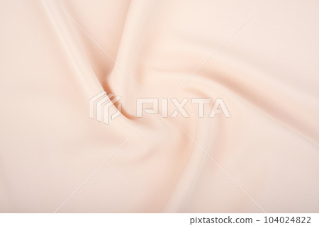 The texture of the satin fabric of beige color for the background 104024822