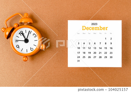 December 2023 Monthly calendar for the organizer to plan 2023 year with alarm clock on yellow 104025157