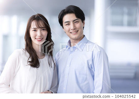 A young couple looking at the camera and smiling Image of working couples and dinks 104025542
