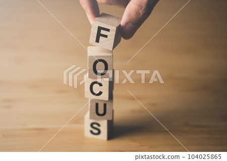 Wooden block of focus. businees achievement goal and concentration concept. 104025865