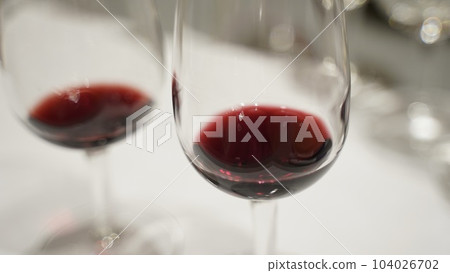 wine glass filled with red wine wine glass filled with red wine 104026702