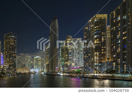 Urban landscape of downtown district of Miami Brickell in Florida, USA. Skyline with brightly illuminated high skyscraper buildings in modern american megapolis 104026730