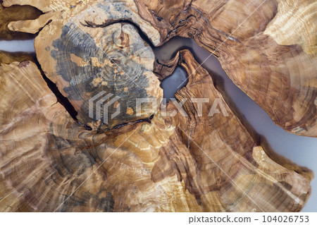 Tree cut slice section, uneven shape, natural texture, soft colored brown and yellow stump natural vintage cracked old colorful background. Do It Yourself art concept. 104026753