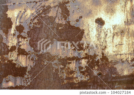 Old cracked abstract grunge vintage texture copy space sunny background, retro pattern. White irregular spots paint peeling of brown concrete or wooden wall or ceiling flat surface. 104027184