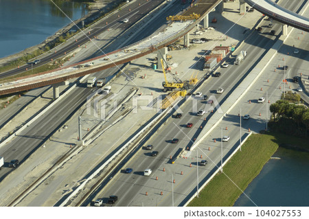 Industrial roadworks in Miami, Florida. Wide american highway junction under construction. Development of interstate transportation system for rapid transit for long distance travelling Industrial roadworks in Miami, Florida. Wide american highway junction under construction. Development of interstate transportation system for rapid transit for long distance travelling 104027553