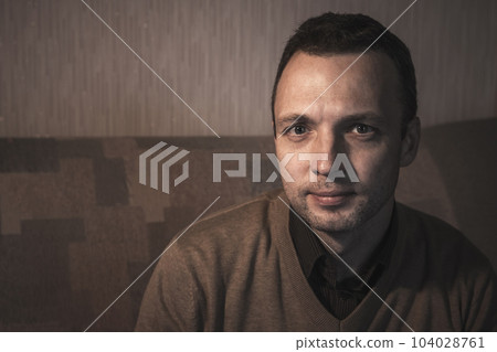 Portrait of serious young adult Caucasian man, close up photo 104028761