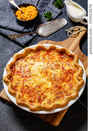 quiche with cheese and bacon filling, top view 104028879