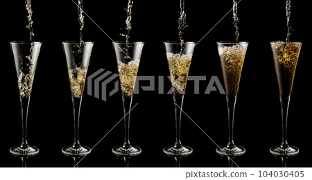 Pouring sparkling wine into a glass on a black background. 104030405