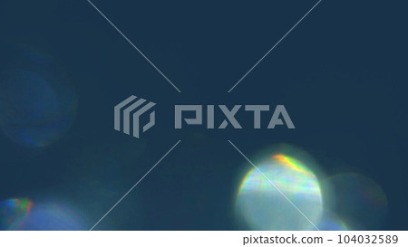 Prismatic light on underside of navy background Prismatic light on underside of navy background 104032589