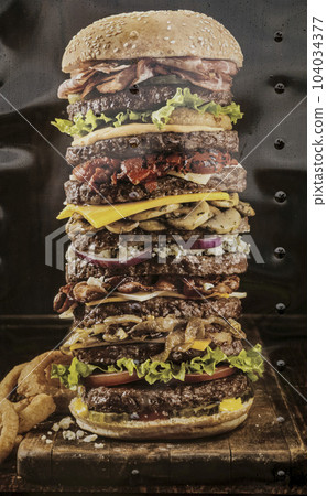 Huge hamburger with 10 layers of beef 104034377