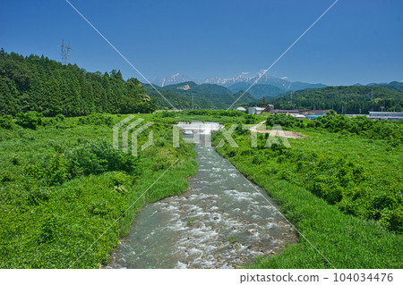 The view from the Kamiichikawa Bridge over the Kamiichigawa Kamiichigawa and Mt. Tsurugi in the Northern Alps during the rainy season The view from the Kamiichikawa Bridge over the Kamiichigawa Kamiichigawa and Mt. Tsurugi in the Northern Alps during the rainy season 104034476