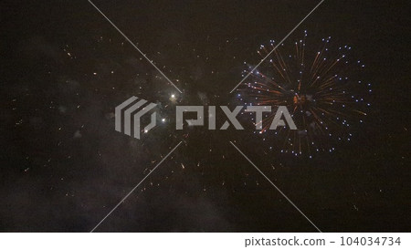 Fireworks blooming in the night sky in midsummer Fireworks blooming in the night sky in midsummer 104034734