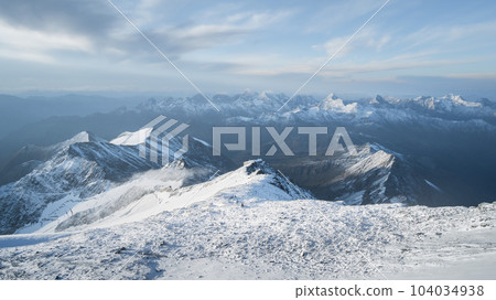 Alpine landscape with hut surrounded by big peaks covered by snow and ice, Austrian Alps, Europe Alpine landscape with hut surrounded by big peaks covered by snow and ice, Austrian Alps, Europe 104034938