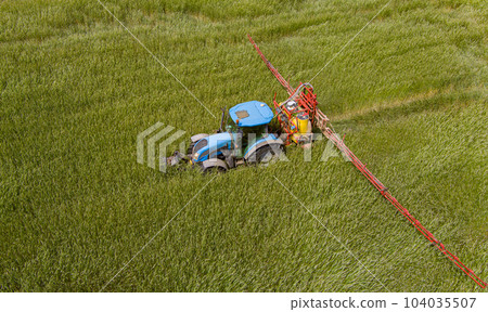 Tractor spraying pesticides 104035507