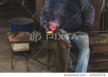 Blown glass artist 104035558