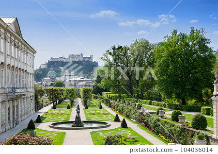 Salzburg city in Austria, historic center with Baroque Mirabell Palace and Garden, and with Hohensalzburg Fortress in the distance, one of the largest fortress in Europe, dating from the 11th century. 104036014