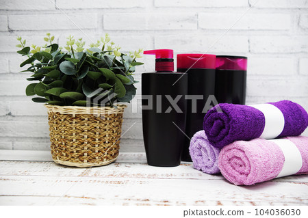 Clean towels, Shampoo, Liquid Soap with Other Toiletry and interior accessories with copy space Clean towels, Shampoo, Liquid Soap with Other Toiletry and interior accessories with copy space 104036030