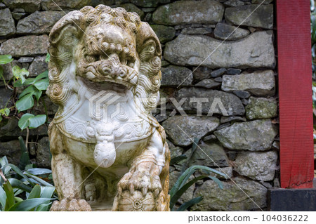 Asian lion sculpture in Madeira garden Asian lion sculpture in Madeira garden 104036222