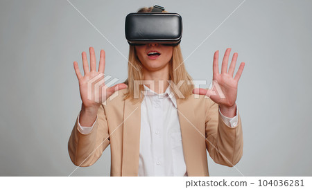 Business woman use virtual reality headset helmet to play simulation game app watching video content 104036281